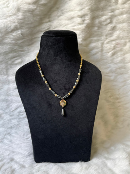 Saturn necklace with black beads